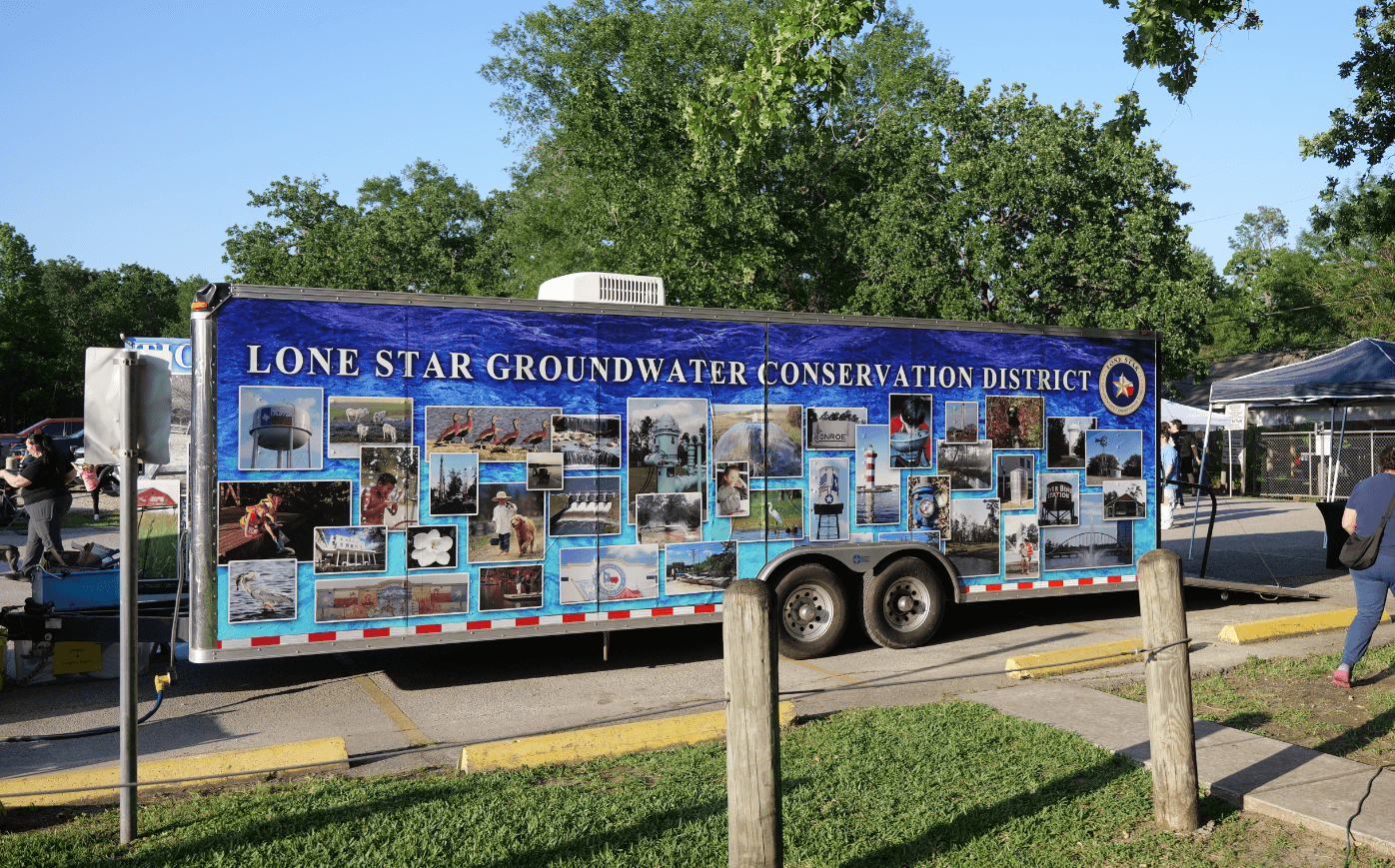 a trailer covered in small photos of nature and water tanks with the text Lone Star Groundwater Conservation District