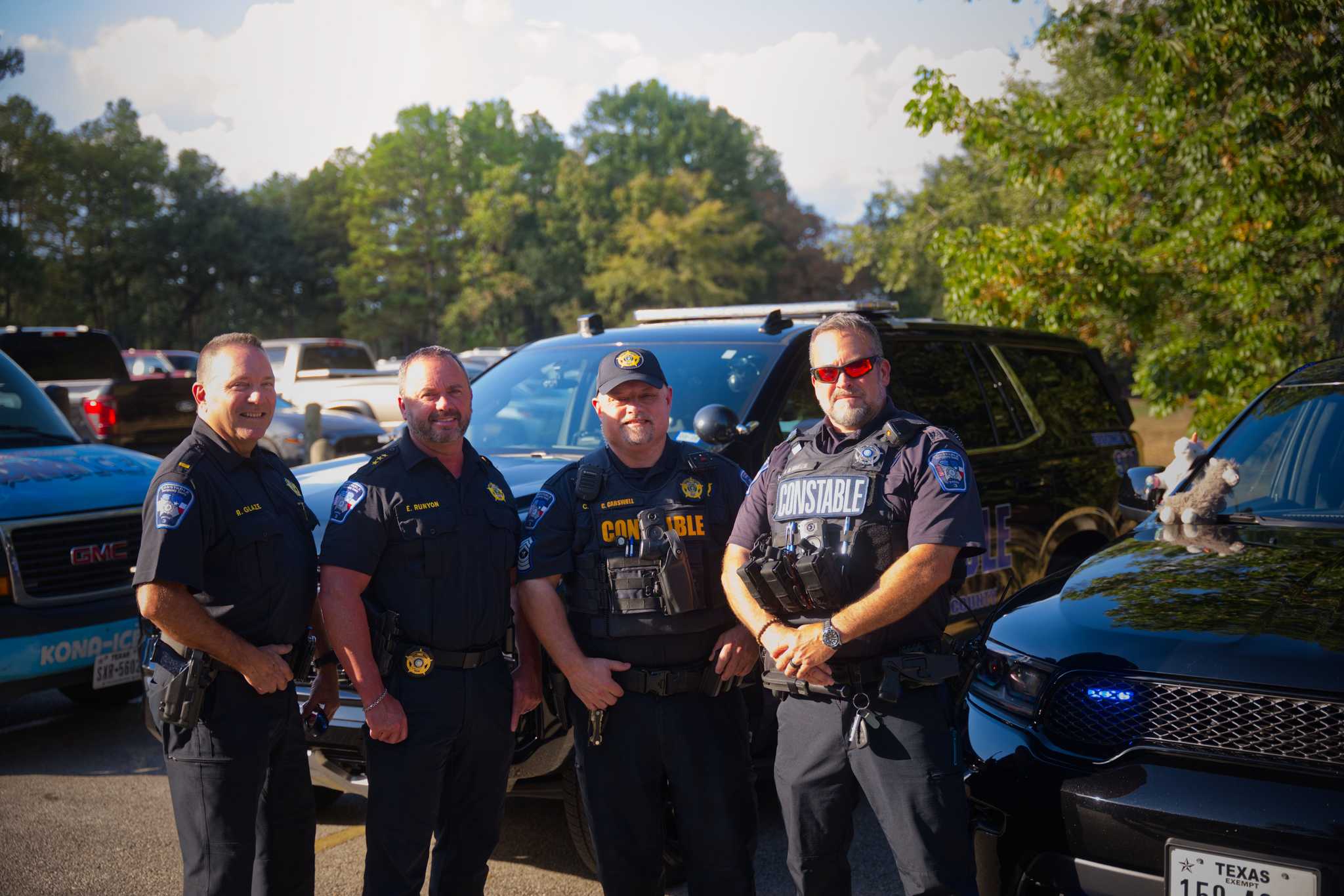Constables standing in front of cruisers