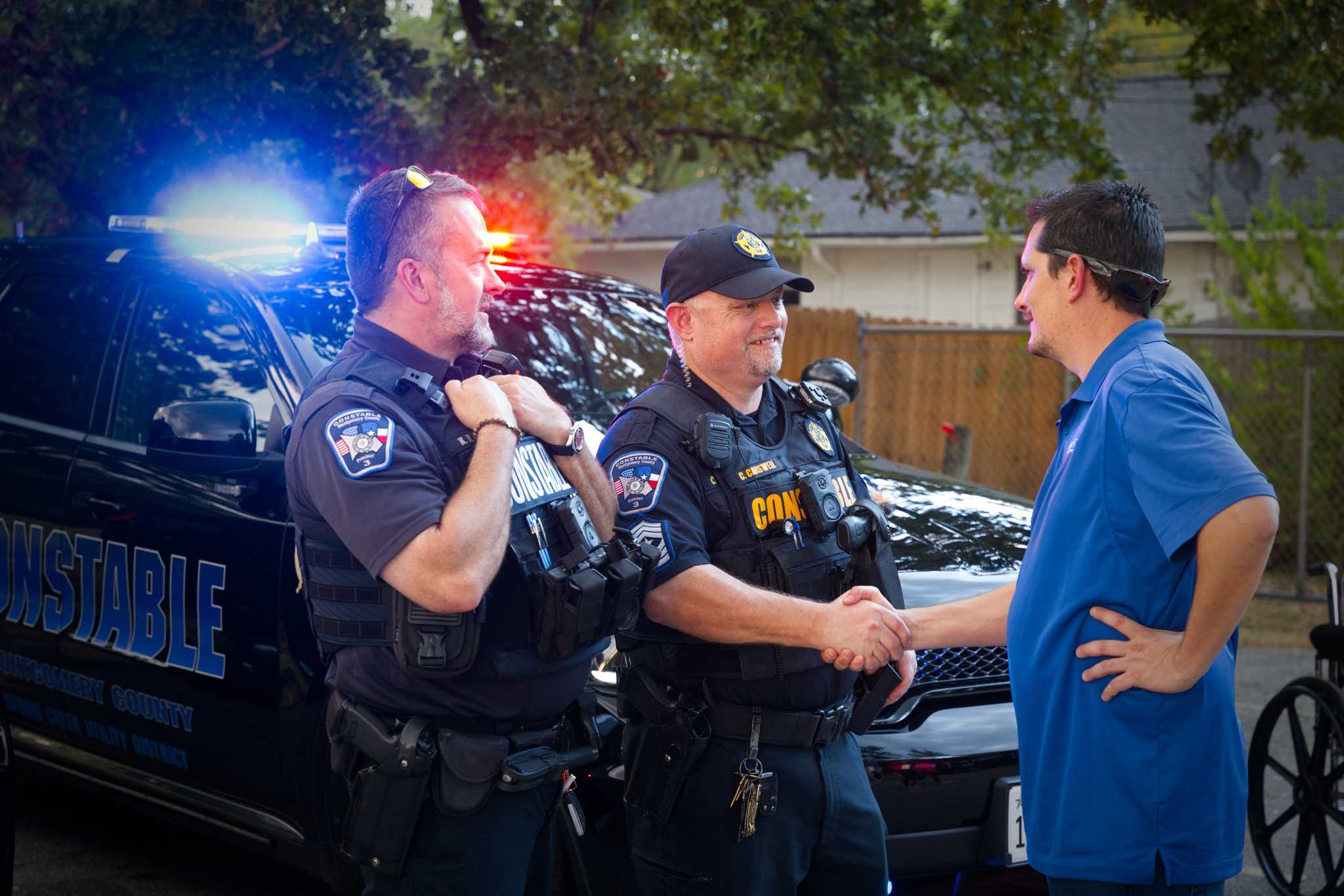 Director Fusca shaking hands with constable