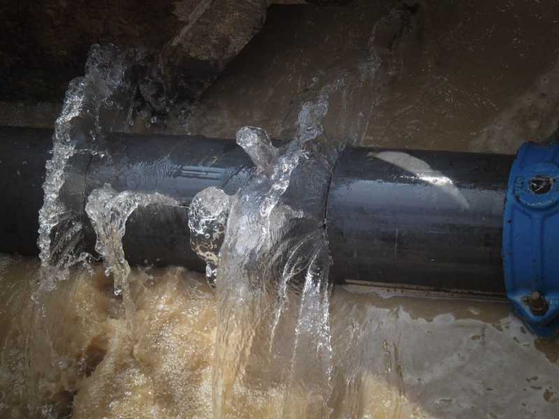 Water leaking through cracked pipe